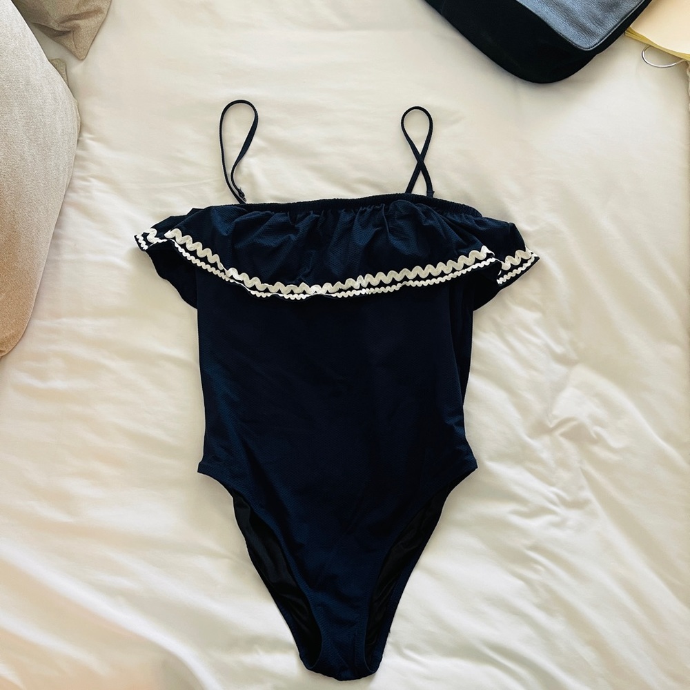 One piece navy and white J.Crew bathing suit.
